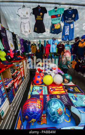 Tarragona, Spain - July 12, 2018: Street market outlet on Rambla Nova in Tarragona selling football merchandise including Barcelona football club jers Stock Photo