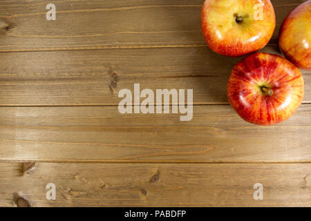 Red apples waiting to be eaten on the kitchen table Stock Photo