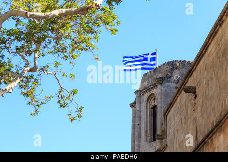 Greek flag on archaeological museum's top in Rhodes, Dodecanese, Greece Stock Photo