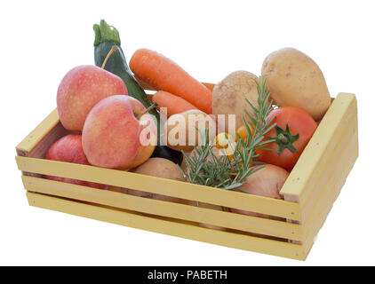Assorted ordinary, common fruit and vegetables in wooden box isolated on white background. Home garden produce. Stock Photo