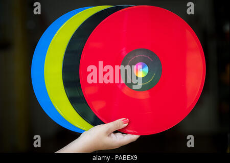 Embargoed to 0001 Monday July 23 A woman holds 12 inch vinyl records. Music lovers will be asked to nominate and share the album that has most inspired them for the first National Album Day, launched in the year of the 70th anniversary of the first LP. Stock Photo