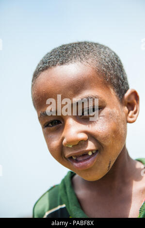 OMO VALLEY, ETHIOPIA - SEP 19, 2011: Portrait of an unidentified Ethiopian boy in Ethiopia, Sep.19, 2011. People in Ethiopia suffer of poverty due to  Stock Photo