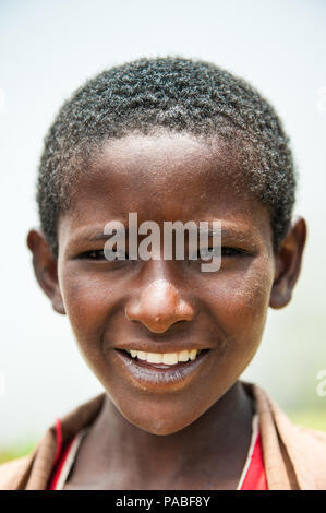 OMO VALLEY, ETHIOPIA - SEP 19, 2011: Portrait of an unidentified Ethiopian boy in Ethiopia, Sep.19, 2011. People in Ethiopia suffer of poverty due to  Stock Photo