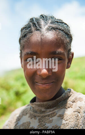 OMO VALLEY, ETHIOPIA - SEP 19, 2011: Portrait of an unidentified Ethiopian boy in Ethiopia, Sep.19, 2011. People in Ethiopia suffer of poverty due to  Stock Photo