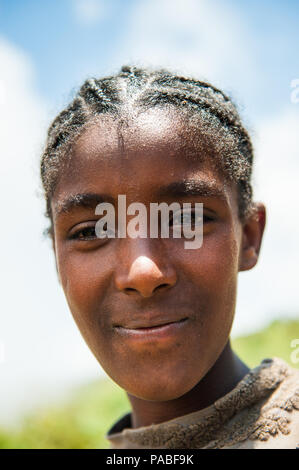 OMO VALLEY, ETHIOPIA - SEP 19, 2011: Portrait of an unidentified Ethiopian boy in Ethiopia, Sep.19, 2011. People in Ethiopia suffer of poverty due to  Stock Photo