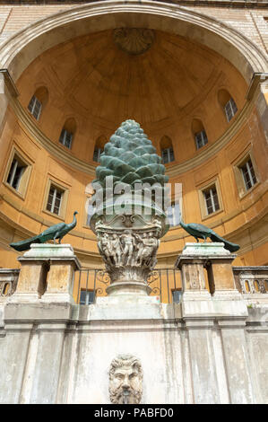 The Pigna, or giant bronze pine cone, sits in a vast niche in the wall of the Vatican Museum. facing the Cortile della Pigna. Stock Photo