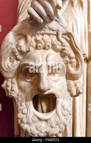 The tragic mask of Hercules held by the 2nd century Roman marble  statue of Melpomene, in the Vatican Museum in Rome. Stock Photo