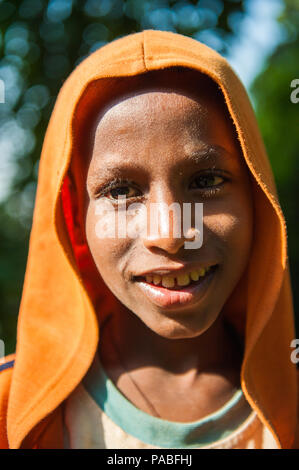 ETHIOPIA - SEPTEMBER 20, 2011: Portrait of an unidentified Ethiopian boy wearing an orange towel in Ethiopia, Sep.20, 2011. People in Ethiopia suffer  Stock Photo