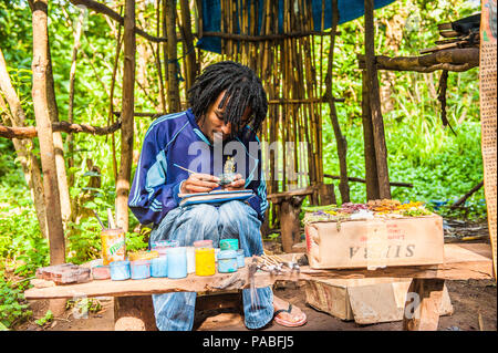 OMO, ETHIOPIA - SEPTEMBER 20, 2011: Unidentified Ethiopian man is drawing. People in Ethiopia suffer of poverty due to the unstable situation Stock Photo