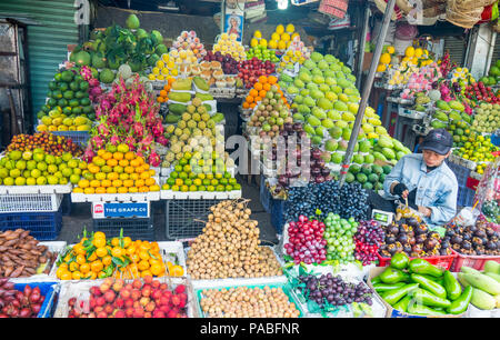 A store selling fresh fruit and vegetables in Pham Van Hai Market Ho Chi Minh City, Vietnam. Stock Photo