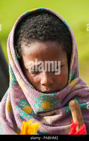 OMO VALLEY, ETHIOPIA - SEP 22, 2011: Unidentified Ethiopian little boy wearing old clothes in Ethiopia, Sep.22, 2011. Children in Ethiopia suffer of p Stock Photo