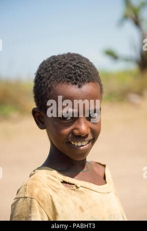 AKSUM, ETHIOPIA - SEPTEMBER 22, 2011: Unidentified Ethiopian boy in the desert. People in Ethiopia suffer of poverty due to the unstable situation Stock Photo