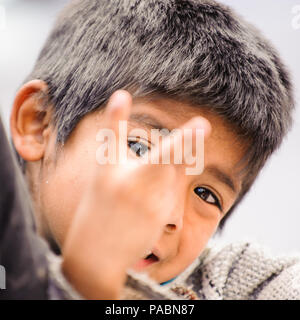 MEXICO CITY, MEXICO - DEC 29, 2011: Unidentified Mexican little boy portrait. 60% of Mexican people belong to the Mestizo ethnic group Stock Photo