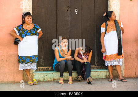 MEXICO CITY, MEXICO - DEC 29, 2011: Unidentified Mexican people near the door.  60% of Mexican people belong to the Mestizo ethnic group Stock Photo
