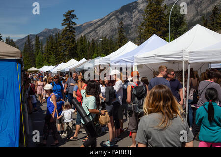 Banff, Alberta, Canada - June 20, 2018: People gathered in the market during a public event in the city. Stock Photo