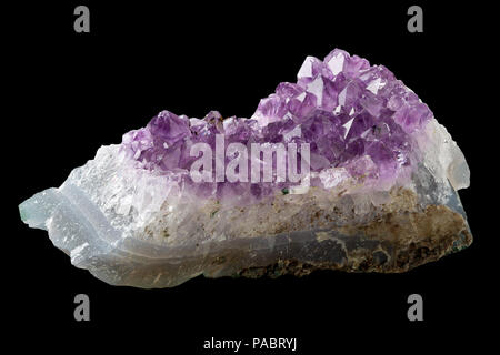 Violet amethyst (citrine) crystal from Uruguay on matrix isolated on black background Stock Photo