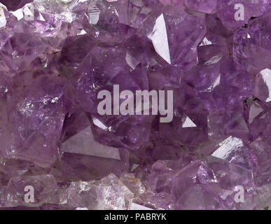 Violet amethyst (citrine) crystal from Uruguay on matrix frame filling close up macro Stock Photo