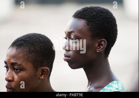 ACCRA, GHANA - MARCH 2, 2012: Unidentified Ghanaian girl smiles. People of Ghana suffer of poverty due to the unstable economic situation Stock Photo