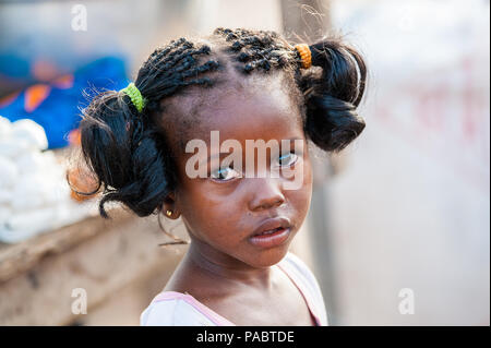 ACCRA, GHANA - MARCH 2, 2012: Unidentified Ghanaian girl portrait in Ghana. People of Ghana suffer of poverty due to the unstable economic situation Stock Photo