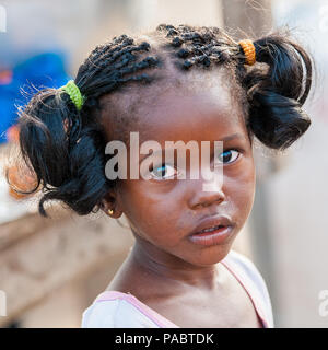 ACCRA, GHANA - MARCH 2, 2012: Unidentified Ghanaian girl portrait in Ghana. People of Ghana suffer of poverty due to the unstable economic situation Stock Photo