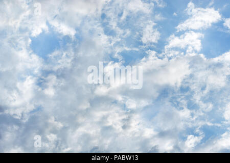 Beautiful sunlit clouds in the blue sky Stock Photo