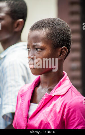 ACCRA, GHANA - MARCH 4, 2012: Unidentified Ghanaian girl portrait in Ghana. People of Ghana suffer of poverty due to the unstable economic situation Stock Photo