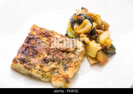 fried fish in the plate with vegetable Stock Photo