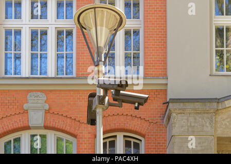 Three security cameras on street lamp. Hamburg, Germany