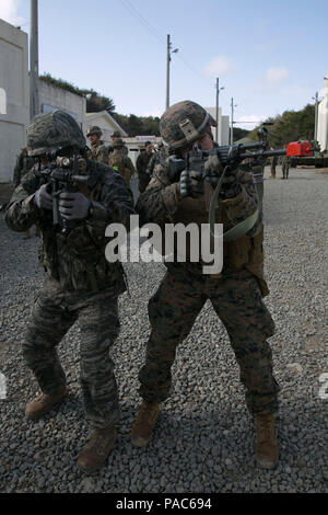 U.S. Marine Corps Lance Cpl. Jason Mongol, motorman, with Weapons Company, 1st Battalion, 3rd Marine Regiment – “The Lava Dogs”, sights into his rifle with an infantry man with the Republic of Korea after clearing a house together during an intergraded training exercise in support of exercise Ssang Yong in Pohang, South Korea, March 9, 2016. Exercise Ssang Yong 2016 is a biennial military exercise focused on strengthening the amphibious landing capabilities of the Republic of Korea, the U.S., New Zealand and Australia. (U.S. Marine Corps photo by MCIPAC Combat Camera Cpl. Allison Lotz/Released Stock Photo