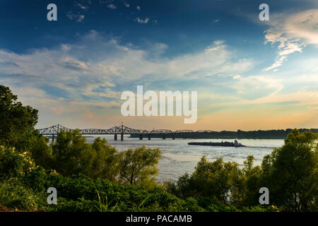 Boat in the Mississippi River near the Vicksburg Bridge in Vicksburg at sunset, Mississippi, USA Stock Photo