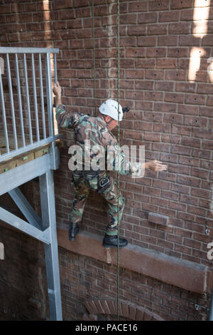 A Royal Netherlands Marine climbs a wall during a fast rope training exercise at the Expeditionary Operations Training Group center on Camp Lejeune, N.C., March 8, 2016. The Royal Marines worked with U.S. Marines as part of a bilateral training exercise to learn new techniques as well as develop working relations between partner nations. (U.S. Marine Corps photo by Lance Cpl. Samantha A. Barajas, 2D MARDIV Combat Camera/Released) Stock Photo