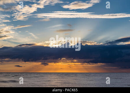 God rays in sunset over water in the Gulf of Mexico from Venice Florida Stock Photo