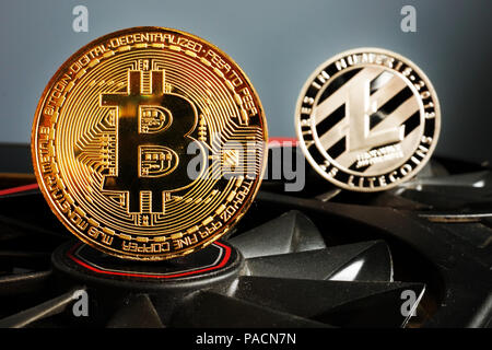 Cryptocurrency mining. Bitcoin BTC and Litecoin LTC coins. Stock Photo