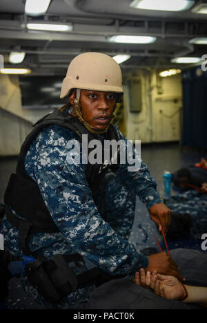 MAYPORT, Fla. (August 8, 2017) Master-at-Arms 1st Class Justin Tanner detains Sailors on the mess deck of the amphibious assault ship USS Iwo Jima (LHD 7) during an anti-terrorism force protection drill. Iwo Jima is in port conducting a scheduled continuous maintenance availability in preparation for their upcoming deployment. Stock Photo