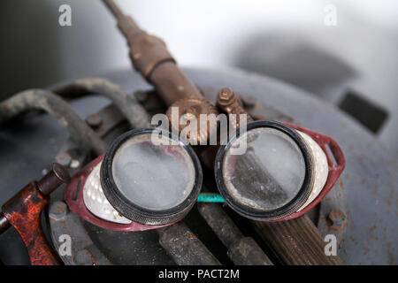 Old protective goggles for welding and grinding Stock Photo