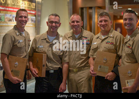 WASHINGTON (August 24, 2017) Master Chief Petty Officer of the Navy (MCPON) Steven S. Giordano, center, with the Navy Band chief selects, from left to right, William Edwards, Colin Wise, Darrell Fitzpartin and Justin Cody after the Navy Band's concert commemorating the 50th anniversary of the office of the Master Chief Petty Officer of the Navy. Members of the U.S. Navy Band Commodores performed for the the Master Chief Petty Officer of the Navy (MCPON) Steven S. Giordano and his guests at a special concert at the U.S. Navy Memorial's Arleigh Burke Theater celebrating the 50th anniversary of t Stock Photo