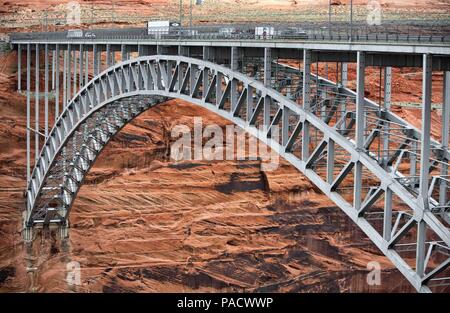 Arizona, USA. 30th May, 2018. The steel arch Glen Canyon Dam Bridge in Arizona, carries U.S. Route 89 across the Colorado River adjacent to the Glen Canyon Dam. It is one of the highest bridges in the U.S., 700 feet (210 m) above the river, and its two lanes are an overall length of 1,271 feet (387 m) and used regularly by tourists. Credit: Arnold Drapkin/ZUMA Wire/Alamy Live News Stock Photo