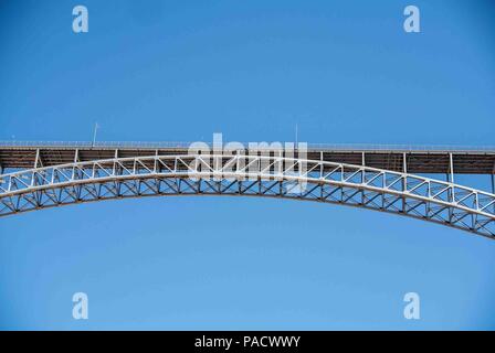 Arizona, USA. 1st June, 2018. The steel arch Glen Canyon Dam Bridge in Arizona, carries U.S. Route 89 across the Colorado River adjacent to the Glen Canyon Dam. It is one of the highest bridges in the U.S., 700 feet (210 m) above the river, and its two lanes are an overall length of 1,271 feet (387 m) and used regularly by tourists. Credit: Arnold Drapkin/ZUMA Wire/Alamy Live News Stock Photo