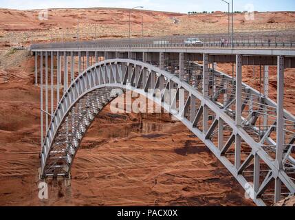 Arizona, USA. 30th May, 2018. The steel arch Glen Canyon Dam Bridge in Arizona, carries U.S. Route 89 across the Colorado River adjacent to the Glen Canyon Dam. It is one of the highest bridges in the U.S., 700 feet (210 m) above the river, and its two lanes are an overall length of 1,271 feet (387 m) and used regularly by tourists. Credit: Arnold Drapkin/ZUMA Wire/Alamy Live News Stock Photo