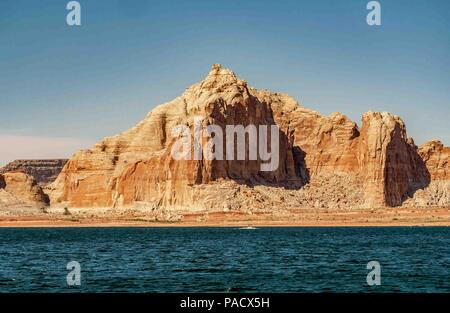 Arizona, USA. 31st May, 2018. The colorful high Castle Rock bluff, of entrada sandstone, stands on the south shore of Wahweap Bay opposite the Wahweap Bay Marina and Lake Powell Resort, a favorite of vacationers and tourists. Credit: Arnold Drapkin/ZUMA Wire/Alamy Live News Stock Photo