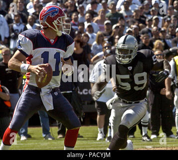 San Francisco 49ers quarterback Ken Dorsey, #7, gets hit by Oakland Raiders  DeLawrence Grant, #59, in the 2nd quarter of their exhibition game on  Saturday, August 14, 2004 at 3Com Park in