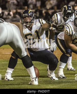 Oakland, California, USA. 11th Sep, 2006. San Diego Chargers guard Kris  Dielman (68) and Oakland Raiders defensive end Tommy Kelly (93) have words  after play on Monday, September 11, 2006, in Oakland