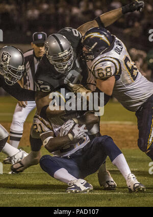 Oakland, California, USA. 11th Sep, 2006. San Diego Chargers guard Kris  Dielman (68) and Oakland Raiders defensive end Tommy Kelly (93) have words  after play on Monday, September 11, 2006, in Oakland