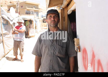 Arsal, Lebanon. 11th July, 2018. A Syrian that goes by the name of Abu Mohammed standing before his accomodation in a refugee camp in the Lebanese town of Arsal. Credit: Jan Kuhlmann/dpa/Alamy Live News Stock Photo