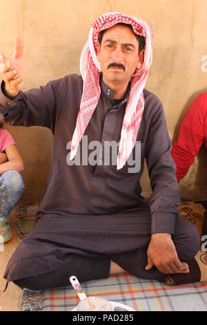 Arsal, Lebanon. 11th July, 2018. Syrian refugee Assad Huria, 51, speaking in a refugee camp in the Lebanese town of Arsal. He and his family want to return to their hometown of Flita next week. Credit: Jan Kuhlmann/dpa/Alamy Live News Stock Photo