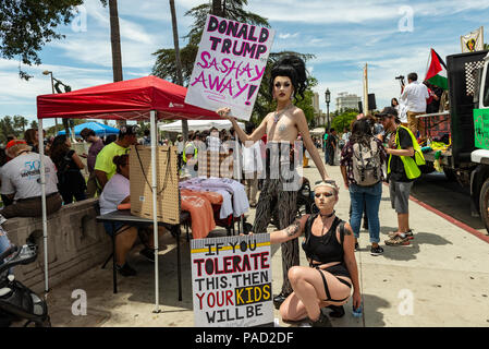 Los Angeles, USA. 21 July 2018.  Families Belong Together March and ICE (Immigration and Customs Enforcement protest in Los Angeles, California on July 21, 2018. Protesors holding signs at Rally polint at McArthur park. Despite the ending of family separations at US borders many children that were taken away from their parents are still not re-united with their families. Credit: Aydin Palabiyikoglu Credit: Aydin Palabiyikoglu/Alamy Live News Stock Photo