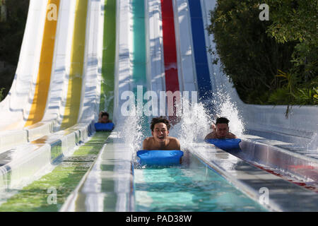 Beijing, China's Guizhou Province. 20th July, 2018. Tourists play at a water park in Jianhe County, southwest China's Guizhou Province, July 20, 2018. Credit: Yang Jiameng/Xinhua/Alamy Live News Stock Photo