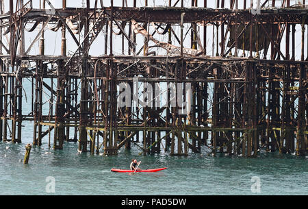 Brighton UK 22nd July 2018 - A beautiful hot sunny day to paddle around the West Pier in Brighton as the heatwave weather continues throughout parts of Britain Credit: Simon Dack/Alamy Live News Credit: Simon Dack/Alamy Live News Stock Photo