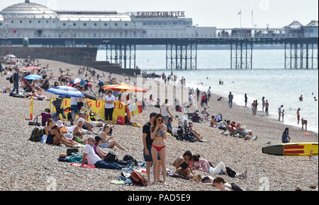 Brighton UK 22nd July 2018 - Brighton beach is busy as the heatwave weather continues throughout parts of Britain Credit: Simon Dack/Alamy Live News Credit: Simon Dack/Alamy Live News Stock Photo