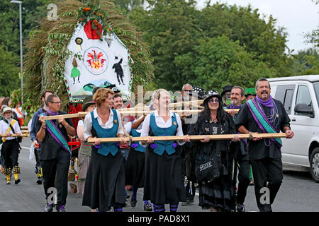 Littleborough, UK. 22nd July, 2018. The cart is pulled at the annual Rushbearing festival reviving the tradition of carrying the rushes to the local church dating back to a time when the church floors where earthen and the rushes were used to cover them for insulation. Littleborough,22nd July, 2018 (C)Barbara Cook/Alamy Live News Credit: Barbara Cook/Alamy Live News Stock Photo